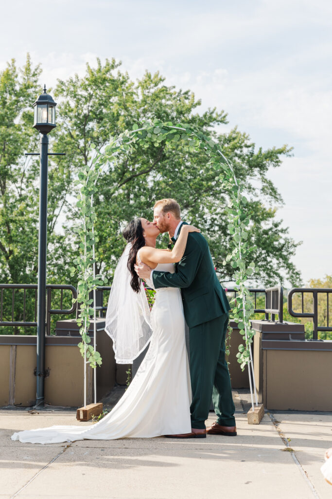 A bride and groom share their first kiss as husband and wife. 

Central Illinois Wedding Photographer.

Amanda Banik Photography