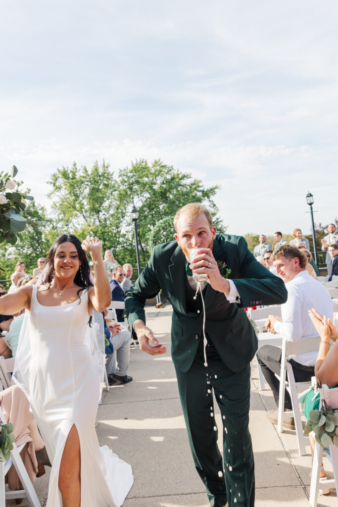 A groom cracks open a beer after marrying his bride. 

Central Illinois Wedding Photographer.

Amanda Banik Photography