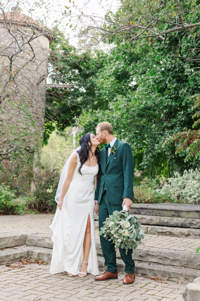 A bride and groom walk and share a kiss. 

Central Illinois Wedding Photographer.

Amanda Banik Photography