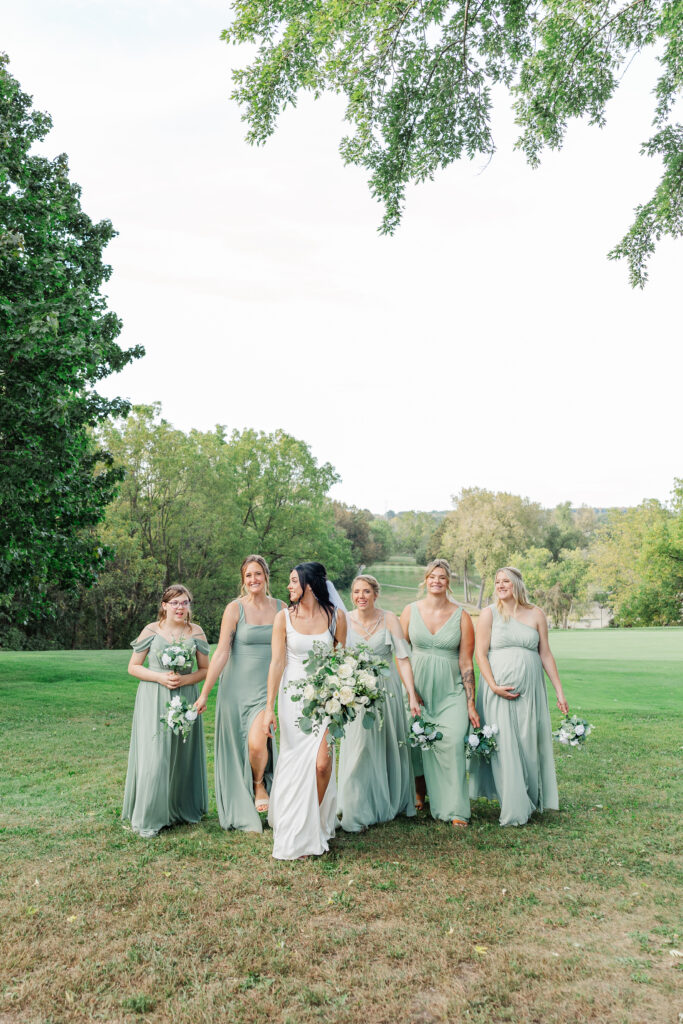 A bride and her girls walking. 

Central Illinois Wedding Photographer.

Amanda Banik Photography