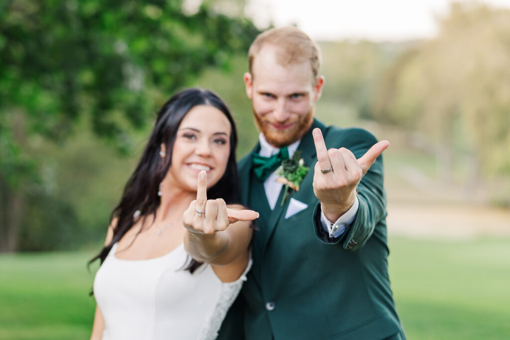 A bride and groom pose for a fun photo showing off their new bling. 

Central Illinois Wedding Photographer.

Amanda Banik Photography