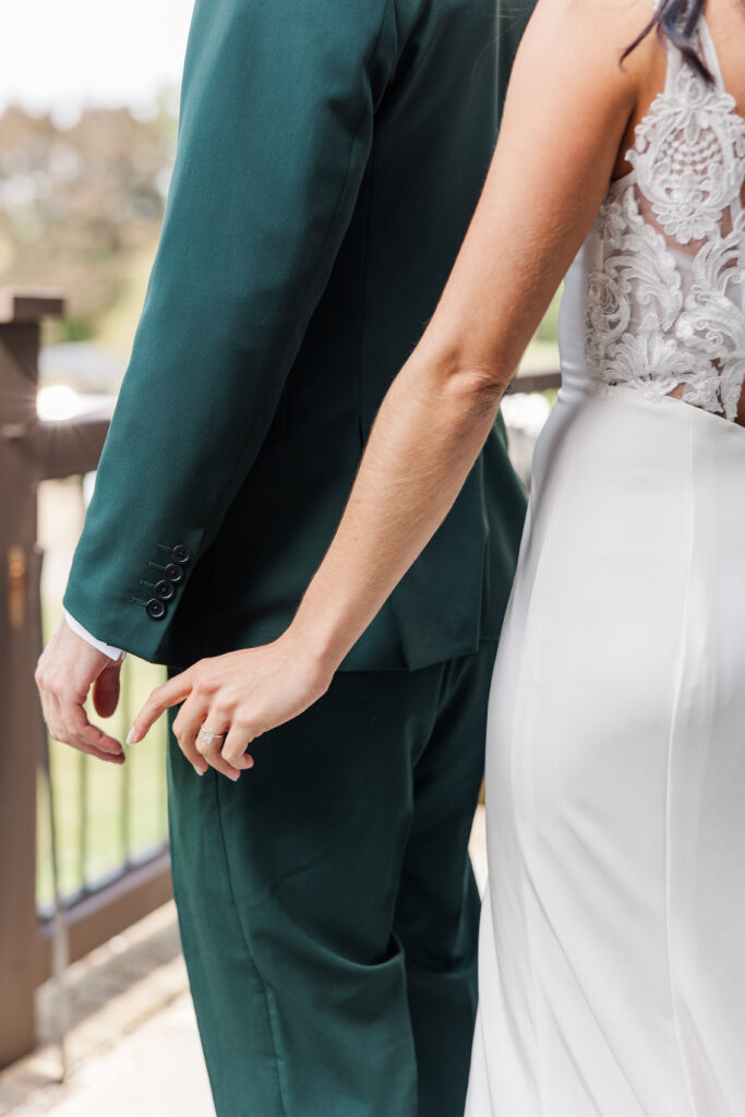 A bride reaches for her groom's hand. 

Central Illinois Wedding Photographer.

Amanda Banik Photography