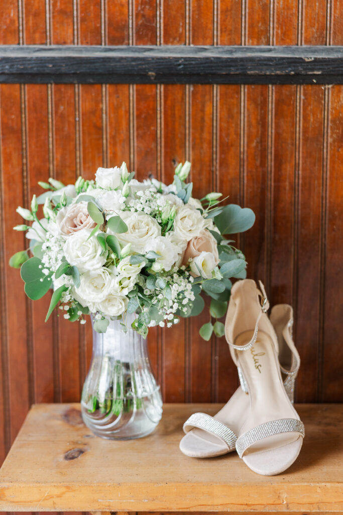 A bride's bouquet and shoes sit for a photo. 

Northfork Farms, Oswego, IL

Photos by Amanda Banik Photography.