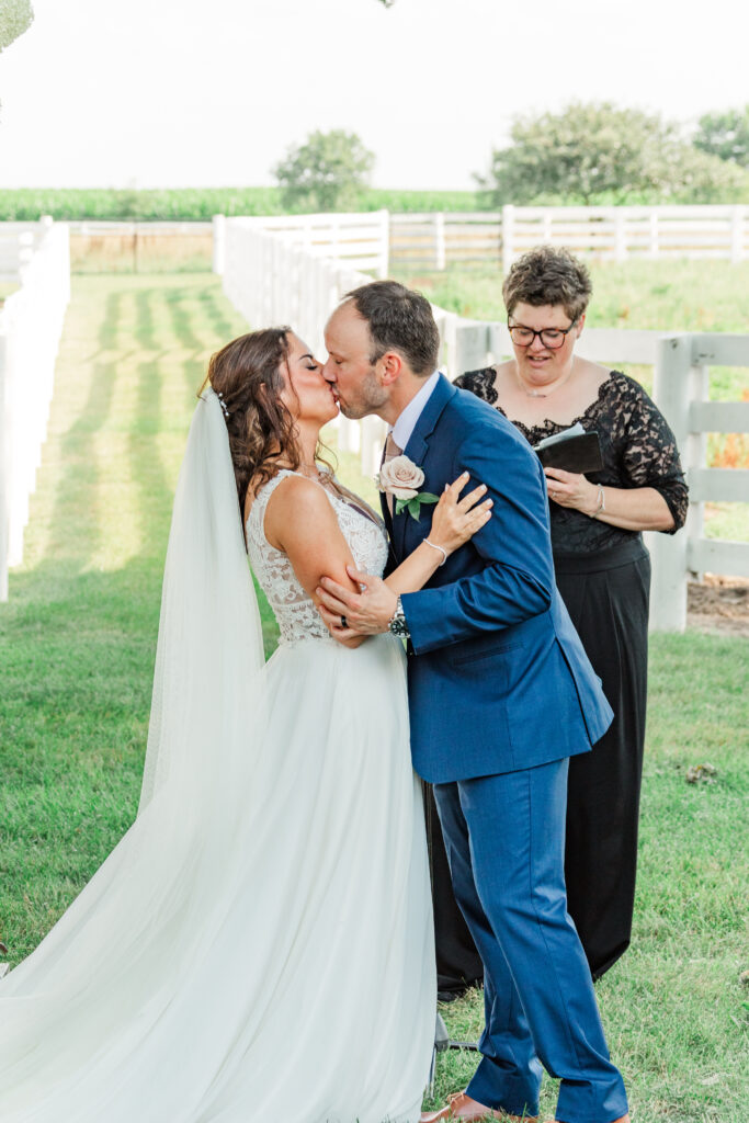 A bride and groom share their first kiss as husband and wife. 

Central Illinois Summer Wedding.

Photos by Amanda Banik Photography