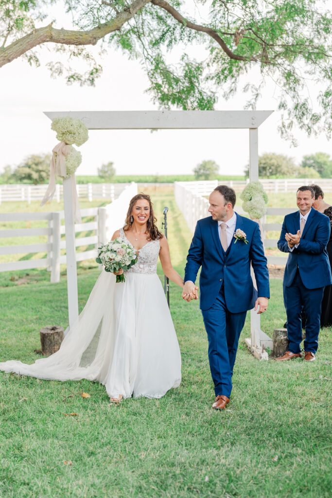 A bride and groom after their central Illinois summer wedding ceremony. 

Photos by Amanda Banik Photography