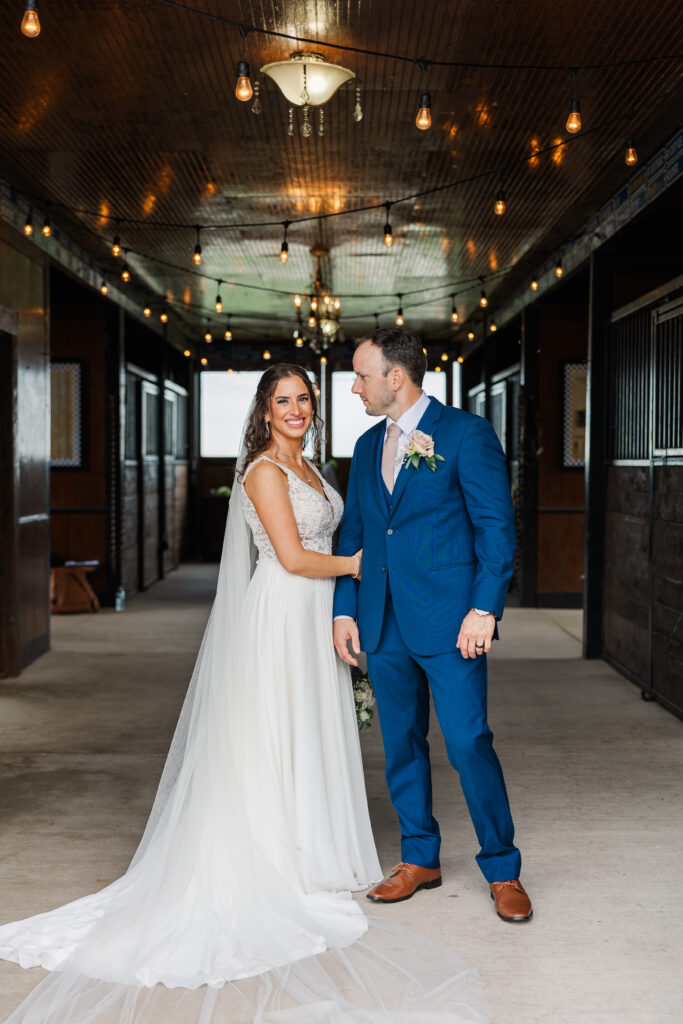 A bride and groom pose for a photo in the barn at Northfork Farms. 

Photos by Amanda Banik Photography