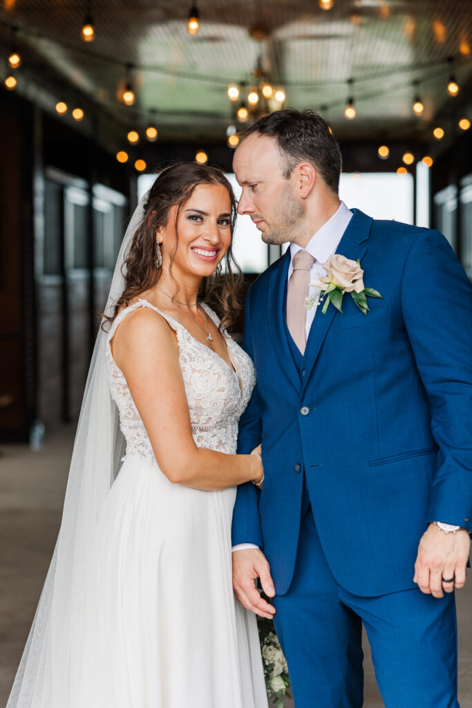 A bride and groom pose for a photo in the barn at Northfork Farms. 

Photos by Amanda Banik Photography