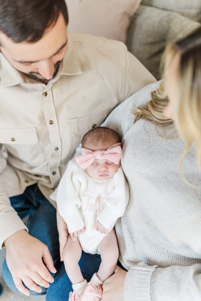 A mom and dad look down at their newborn baby.
Central Illinois Newborn Photographer.
Amanda Banik Photography