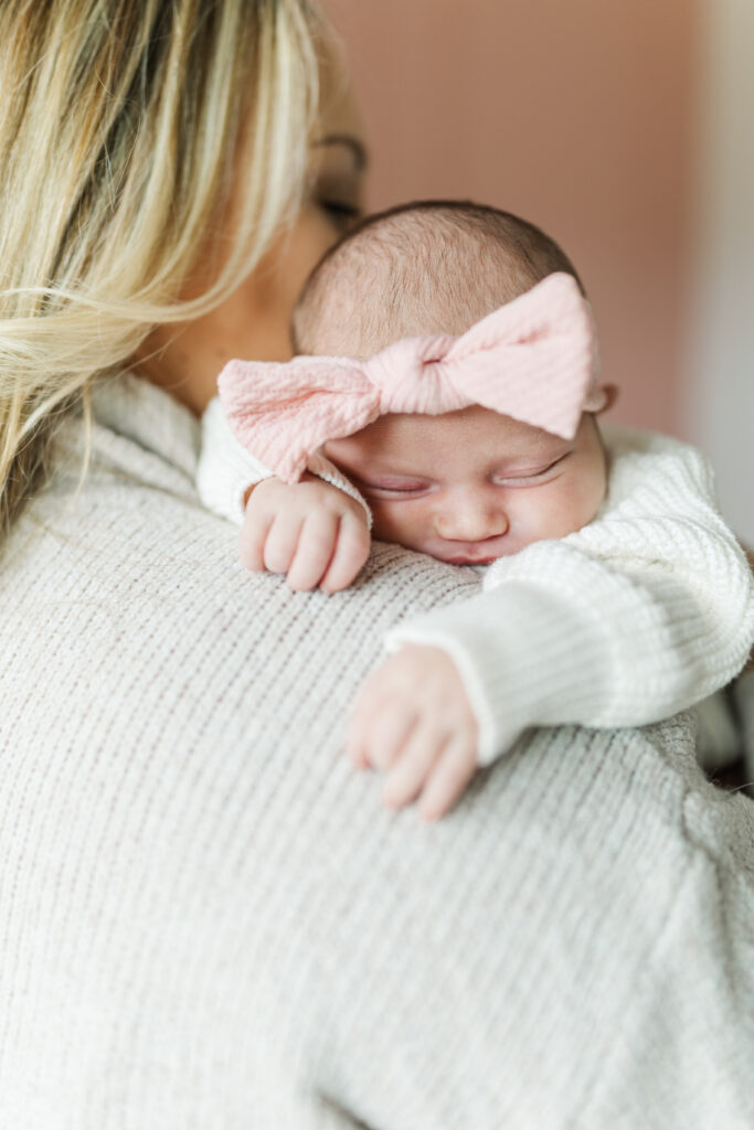 A newborn baby girl sleeps on her mom's shoulder during her Champaign, IL newborn session.
Central Illinois Newborn Photographer.
Amanda Banik Photography