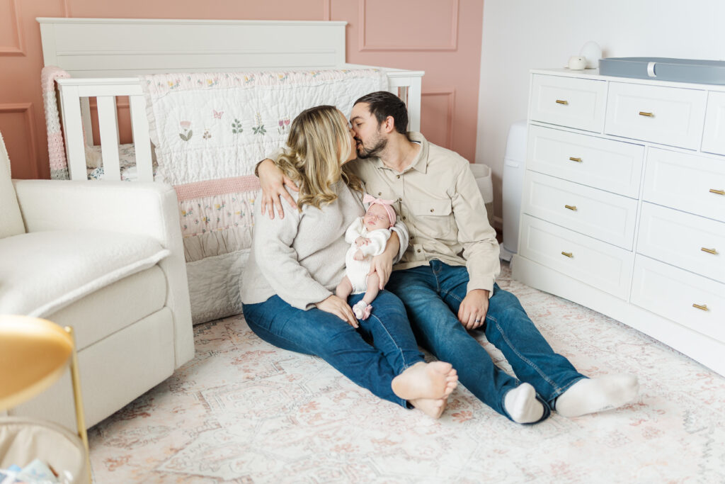 A new mom and dad share a kiss during their in home newborn session.
Central Illinois Newborn Photographer.
Amanda Banik Photography