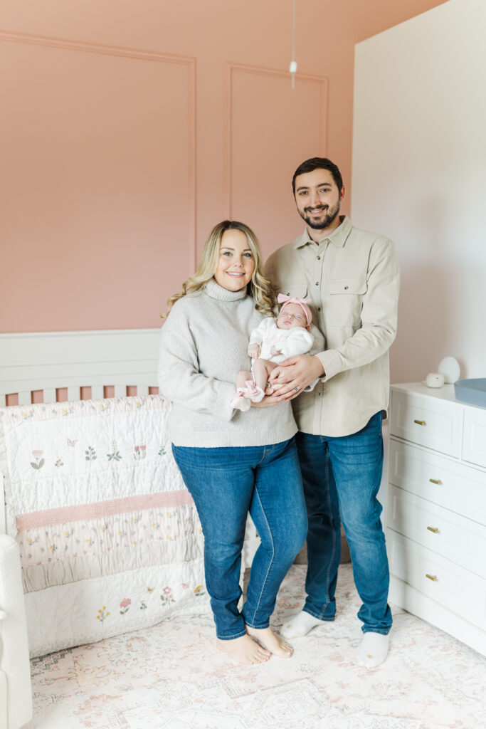 A mom and dad pose with their new daughter during their in home newborn session.
Central Illinois Newborn Photographer.
Amanda Banik Photography