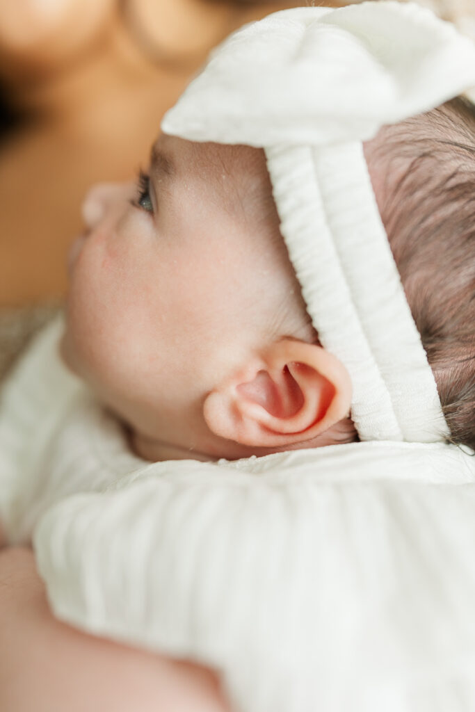 A detail image of a newborn baby girl's ear during her Central Illinois in-home newborn session 

Photos by Amanda Banik Photography